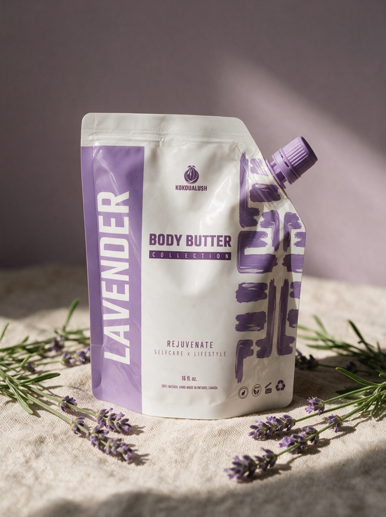 Kokoualush Lavender Body Butter pouch on oatmeal linen with fresh lavender sprigs