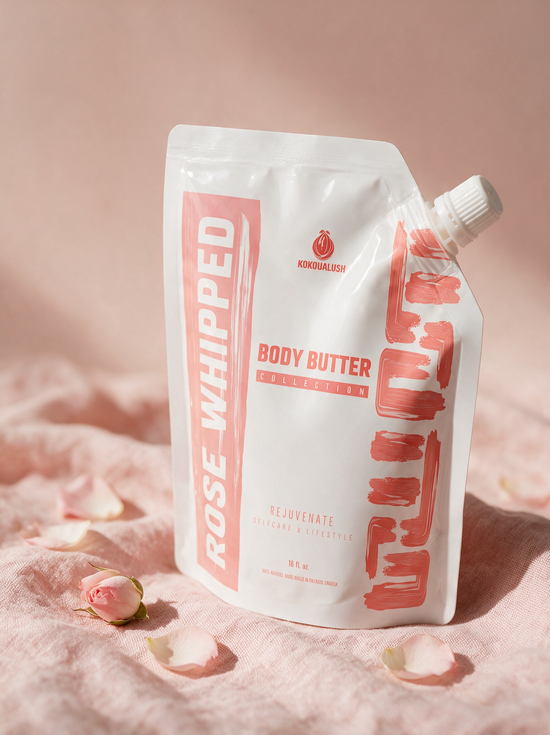 Kokoualush Rose Whipped Body Butter pouch on blush linen with rose petals
