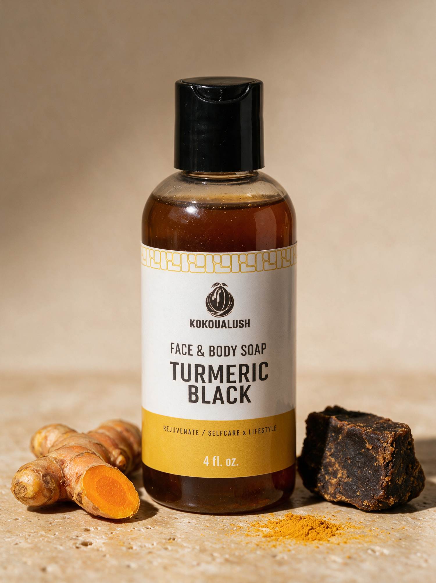 Kokoualush Turmeric Black Face & Body Soap bottle with turmeric root and raw black soap