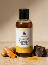 Kokoualush Turmeric Black Face & Body Soap bottle with turmeric root and raw black soap