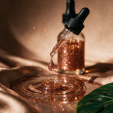Kokoualush Good Ting Dem bronze shimmer Body Glow Oil sparkling droplet crown splash with monstera