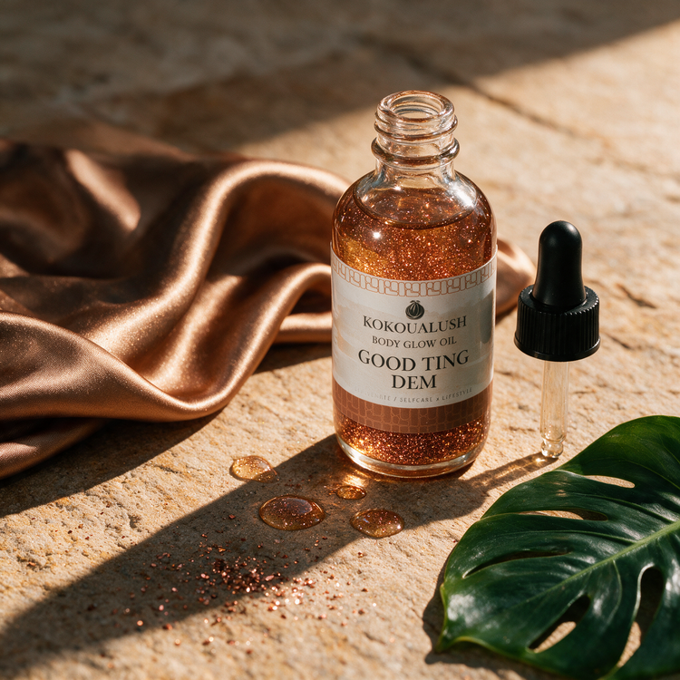How to use Kokoualush Good Ting Dem Glow Oil: dropper dispensing on warm sandstone with monstera