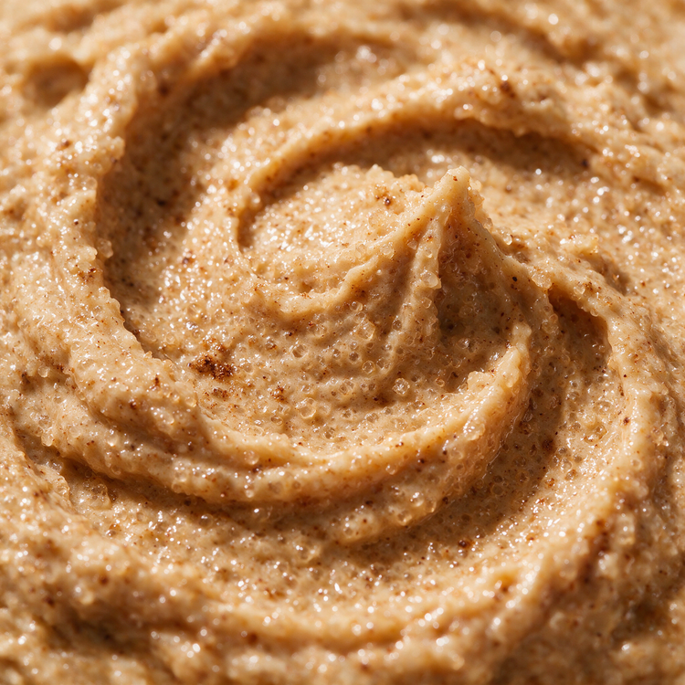 Macro texture of pumpkin spice sugar scrub crystals glistening with oil