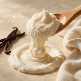 Kokoualush Vanilla Cashmere Body Scrub wooden scoop lifting ivory cream sugar scrub