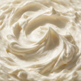 Macro texture of pure whipped shea body butter peaks
