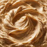 Macro texture of warm cream vanilla cocoa whipped body butter