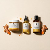 Turmeric Trio contents: scrub, face and body oil, and Turmeric Black soap