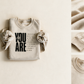 Sand crewneck with fabric, cuff and neckline detail vignettes