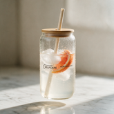 Kokoualush Selfcare affirmation glass with an iced drink and glass straw