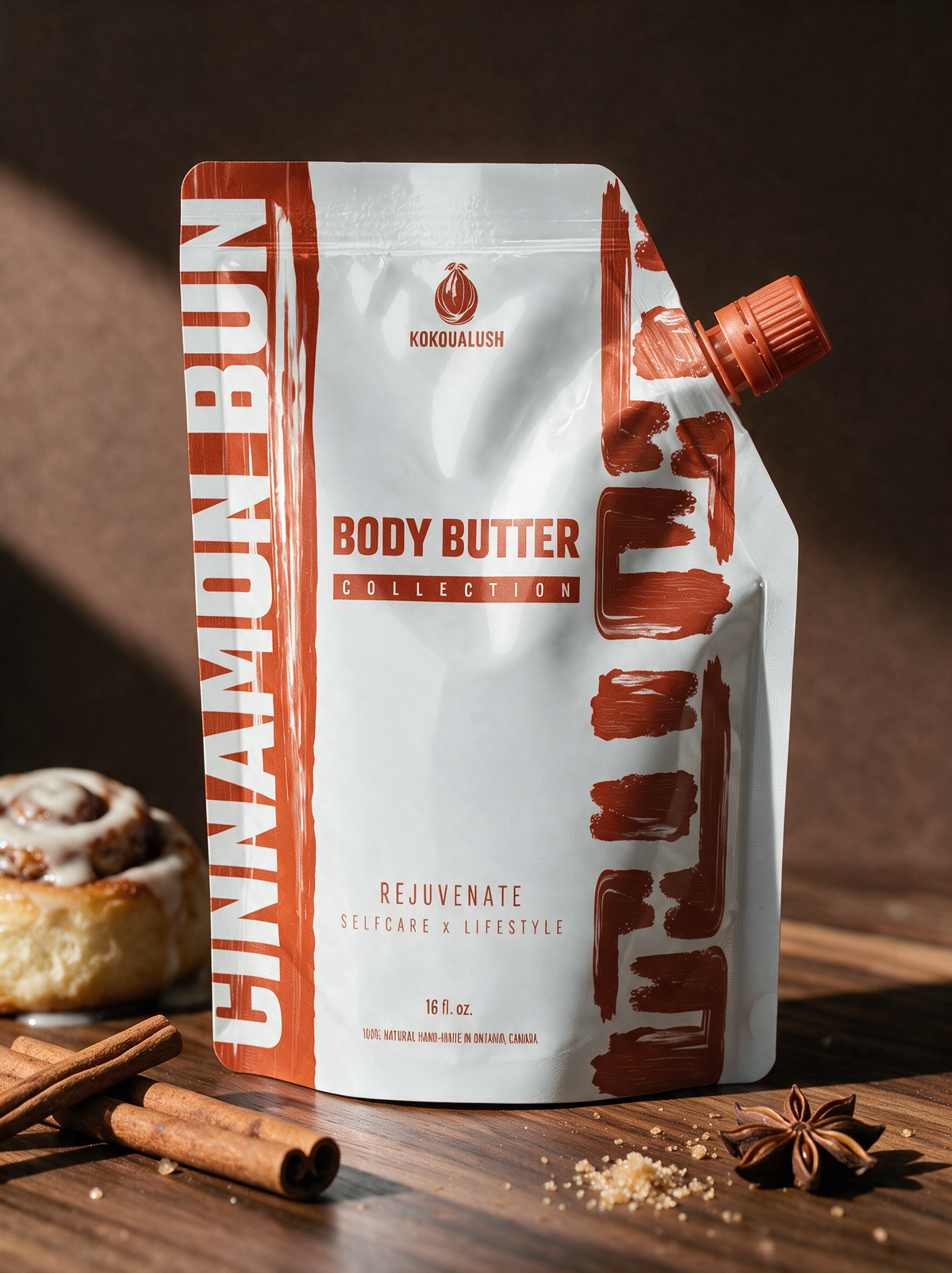 Kokoualush Cinnamon Bun whipped body butter 16 oz spout pouch with cinnamon roll and cinnamon sticks