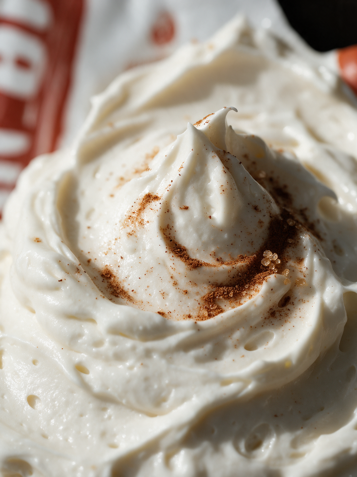 Close-up of whipped body butter texture with a cinnamon swirl