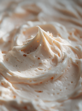 Close-up of airy whipped body butter texture dusted with brown sugar crystals